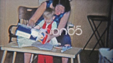 1962: Mom and Baby Son Play New Hammer Pegs Toy Game