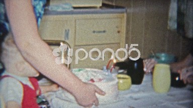 1962: Aunt Smokes Cigarette While Kid Blows Out 2nd Birthday Cake Candle
