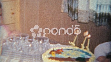 1963: Grumpy jealous stonefaced sister at brothers 3 year old birthday party.