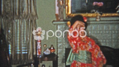 1957: Girl Dancing in Geisha Outfit with Japanese Style Movements Indoors