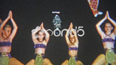 1957: Arabian style school performance by young girls costumed dance troupe.
