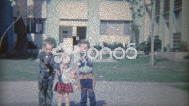 1964: Armed Children with Toy Guns Holstered Shooting and Laughing.
