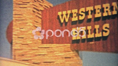 1959: Family having lunch at picnic table staying at Western Hills Motel.
