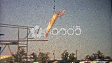 1959: High hotel diving board to swimming pool clips mastered by child waterman.