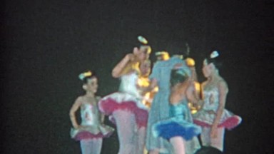 1964: Ballet Teacher Giving Instruction to Young Girls Practicing