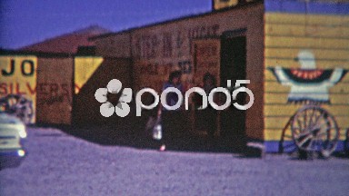 1964: Southwestern Gift Shop Mother Daughter Family Exits Gravel Parking Lot.