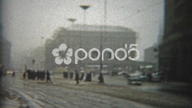 1966: Snowy Slushy Day in Urban Rotterdam with Classic Black Taxi Cars and Traffic