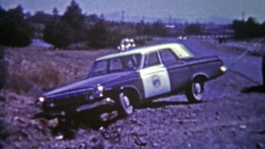 1964: Crashed Cop Car Needs a Tow from Roadside Ditch After Police Chase Gone Wrong