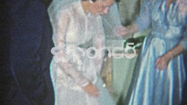 1964: Bride Showing Off Garter Belt to Wedding Party in Fort Worth, Texas