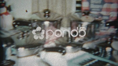 1964: Wedding gifts laid out on a kitchen table with 1960s domestic goods