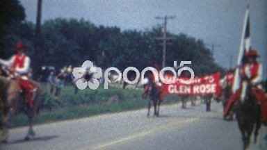1966: Welcome to Glen Rose Texas Parade Horses Red Cowboy Outfits.