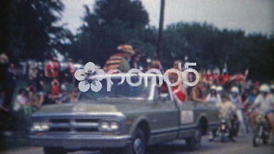 1962: Public parade featuring kids riding motorcycles and bikes in Glen Rose, Texas