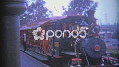 1966: Disneyland Railroad Train with Conductor Keeping a Steady Watchful Eye.