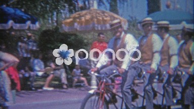 1966: Disneyland 4 man bike ridden by barber shop quartet style fashion folks.