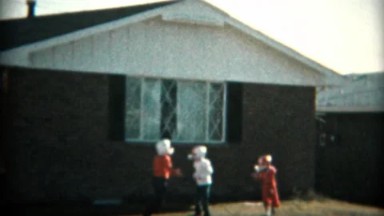 1957: Kids Practicing Tackle Football in the Front Yard with Helmets and Pads