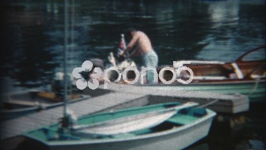 1960: Dad and Son Fixing Family Wooden Boat Motor Propeller