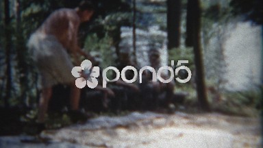 1960: Dad Times and Cheers on Family Member to Set Up Camping Tent