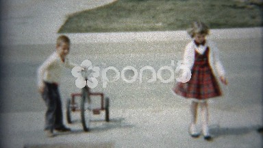 1961: Girl Jumping Rope in Driveway Sends Brother Away on Bike