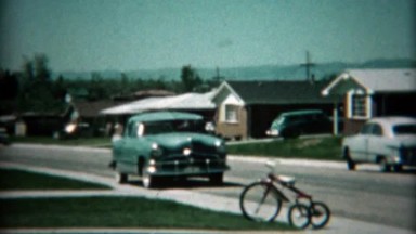 1961: New Family Car Pulls Into Driveway for Inspection by Excited Family