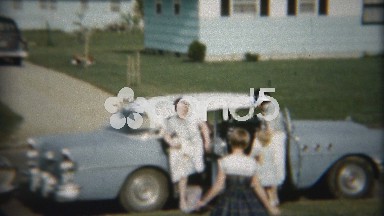 1958: Aunt arrives from road trip in fancy blue Buick car.