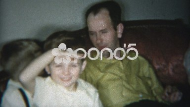 1953: Brothers Relaxing With a Cigar While Kids Play Wildly Around