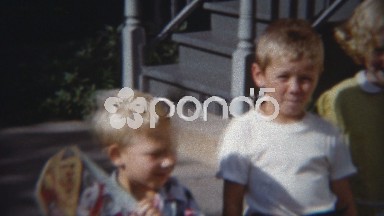 1955: Urban Children Play Outdoor Bike Riding Following the Oldest Child