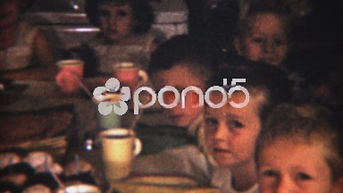 1954: Well mannered co-ed children's birthday party cupcakes ready.