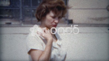 1954: Mom taking 3 boys to zoo on hot sunny summer day.