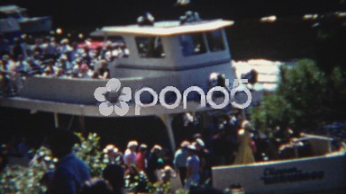 1954: People loading a crowded double decker tourist ferry boat.