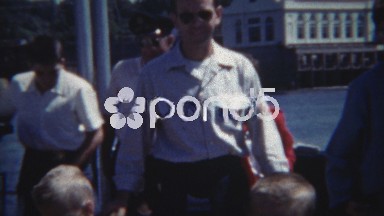 1954: Identically dressed brothers being patient on a ferry boat ride.
