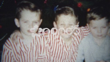 1955: Christmas morning sleepy brothers get excited about the holiday.