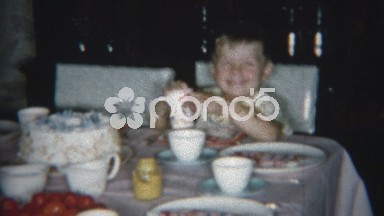 1954: Boy and girl happy to be in front of a giant table of food.