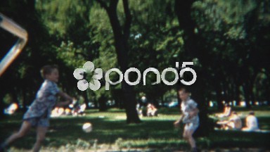1954: Boys practicing softball swings in shady summer park.