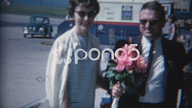 1965: Man with 2 Women Chooses Flowers from Bouquet