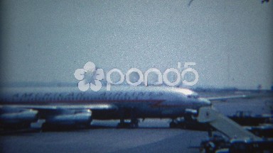 1965: American Airlines DC-8 Airplane Parked at Las Vegas Airport Gate