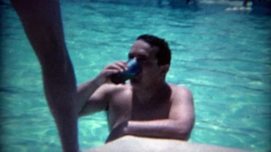 1965: Man Caught Drinking in the Pool by Sexy Legged Cocktail Waitress