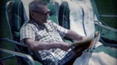 1965: Mob Boss Relaxing Poolside at Sands Hotel Reading Magazine