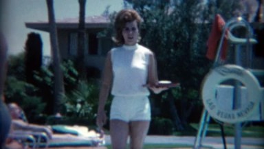 1965: 60's hairdo poolside cocktail waitress at the Sands Casino. LAS VEGAS