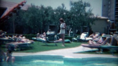 1965: Cocktail waitress across the pool at the Sands Casino. LAS VEGAS