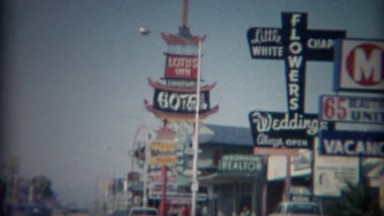 1965: 60's retro business strip motor hotels best western Lotus Inn signs.