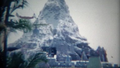 1965: Disneyland Matterhorn amusement park ride roller coaster ski lift.
