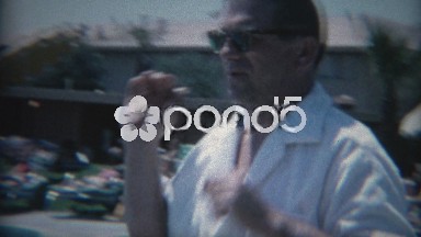 1965: Man leaving Sands Hotel Casino pool area with friends. LAS VEGAS