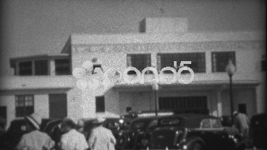 1935: People walking to the Pan American Airways System building. MIAMI, FLORIDA