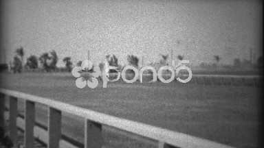 1935: Horse race closeup from guardrail of fast thorobreds approaching. HIALEAH,