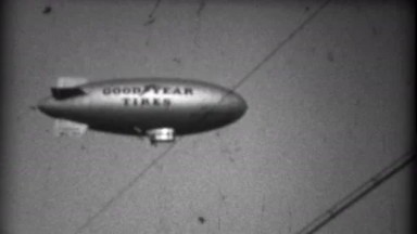 1935: Goodyear Tires Blimp Flying Over Miami Sporting Event