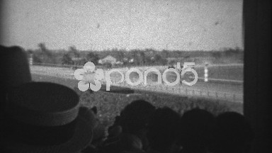 1935: Horses coming around the corner in race at old time racetrack. HIALEAH,
