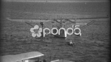 1935: Dingee Boat Rowing to Pan Am Sikorsky S-40 Amphibious Flying Boat