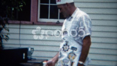 1957: Man in Chef Hat Cooking Barbecue Outdoors in Denver, Colorado