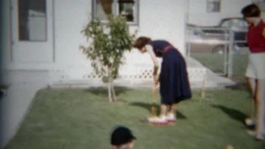 1957: Girl Playing Croquet in Backyard, Denver, Colorado