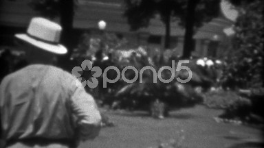 1937: Man Walking Public Garden Grounds Exploring Natural Green Horticulture.